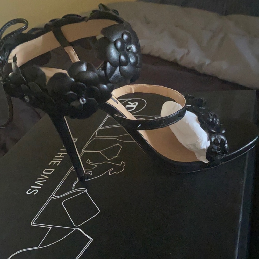 Black flower, & spike heeled shoe